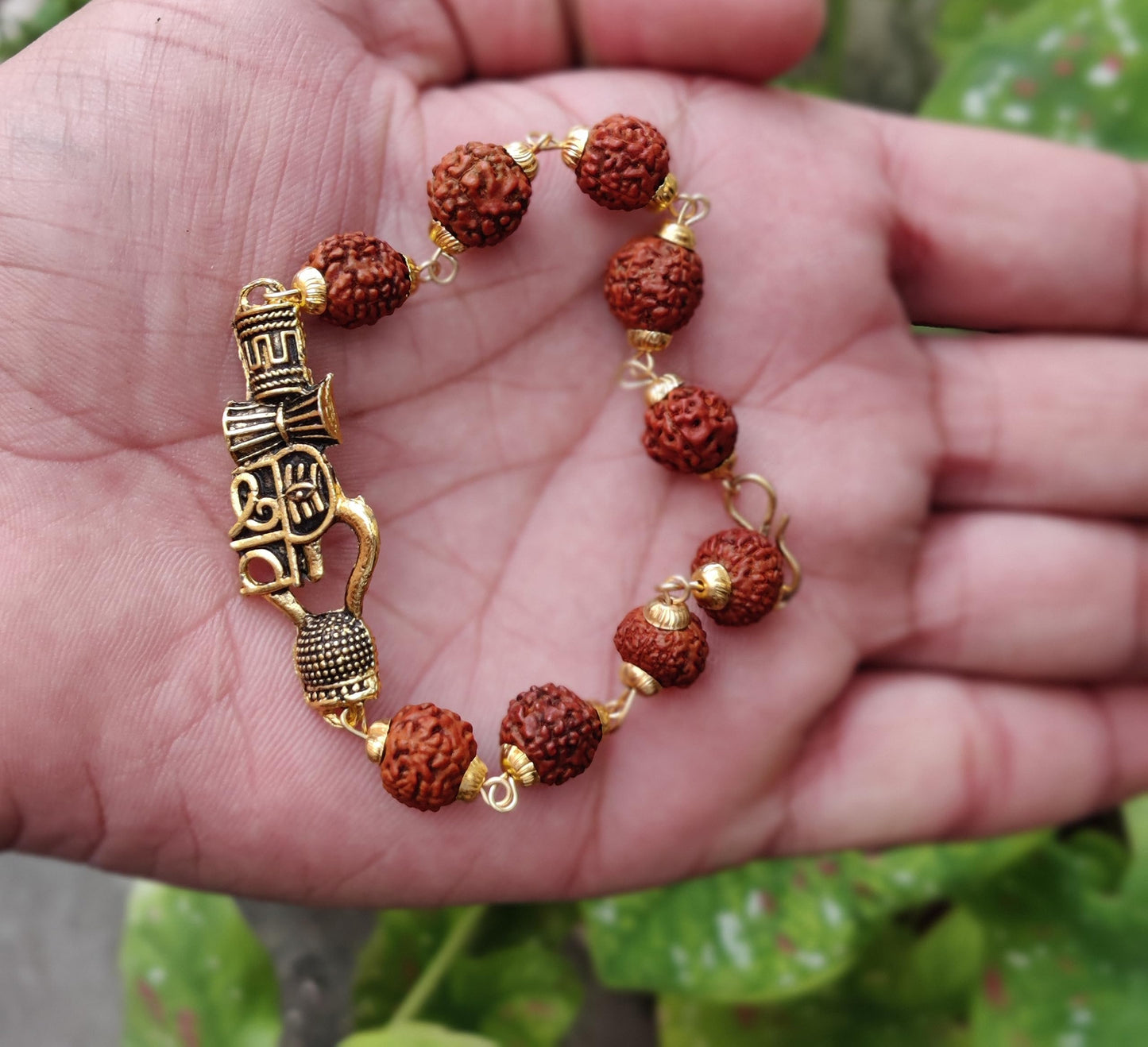 Apnisanskriti Premium Rudrakasha Rakhi Bracelet Golden Cap Shiv with Damru Kamandal or Trishul for Men and Women (Free Size, AAA Quality)